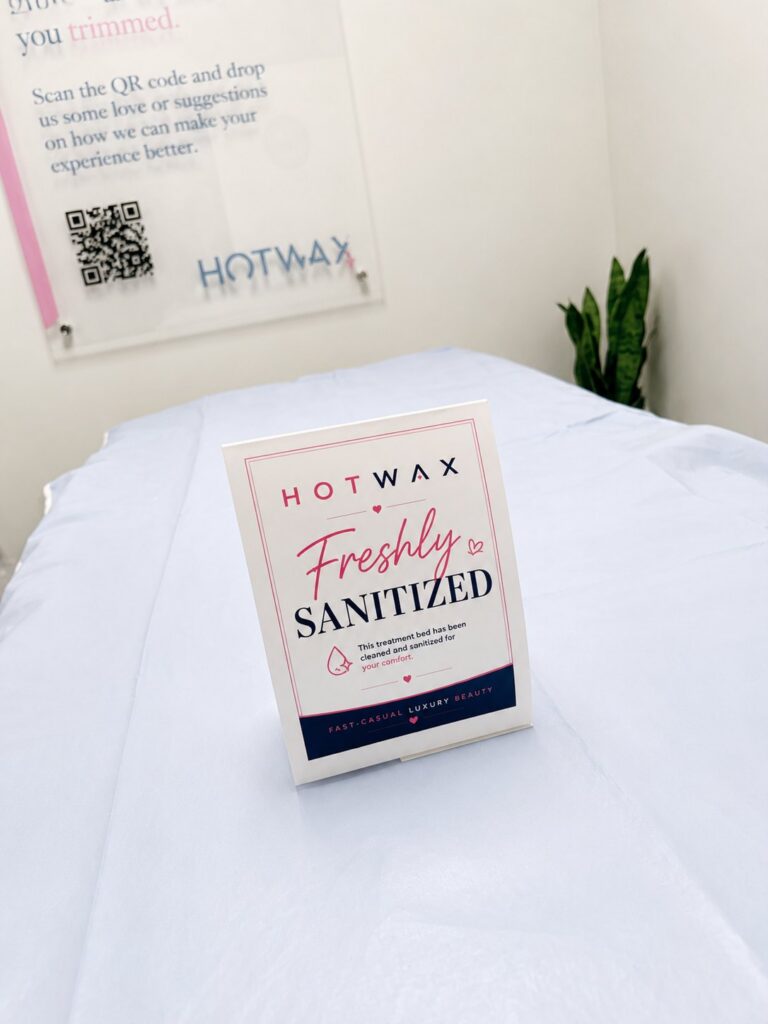 HOTWAX Baltimore treatment bed with Freshly Sanitized sign